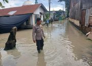 Bhabinkamtibmas Polsek Firdaus Aktif Bantu Warga Terdampak Banjir di Sei Rampah dan Pematang Ganjang
